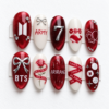 Press-on nails featuring cherry blossom patterns and the BTS logo.
