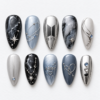 BTS galaxy press-on nails in black, silver and slate blue with star maps, orbit lines and a heart motif