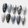 BTS press-on nails featuring the group's logo and the word "ARMY"