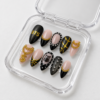 chain accents, geometric gold lines, metallic details press on nails
