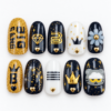 K-pop fan press-on nails in black, gold and white with crowns, stars, hearts, diamond motifs, flower and fan-style lettering