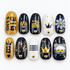K-pop fan press-on nails in black, gold and white with crowns, stars, hearts, diamond motifs, flower and fan-style lettering