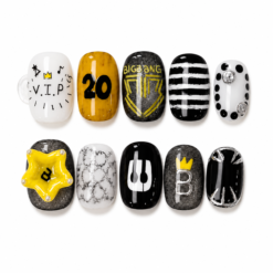 Black gold press-on nails with crown and star art, stripes, bold fan lettering and black, white, gold and gray details.