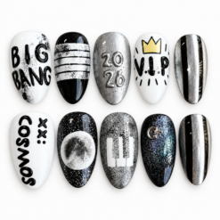 Ten glossy black, white and silver press-on nails with metallic stripes, stars, a crown, space-inspired designs and fan-style lettering.