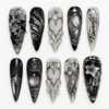 Black silver gothic press-on nails with smoky gray filigree, raised floral details, metallic textures and gem-like accents.