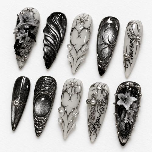 press-on nails with metallic filigree, web-like linework