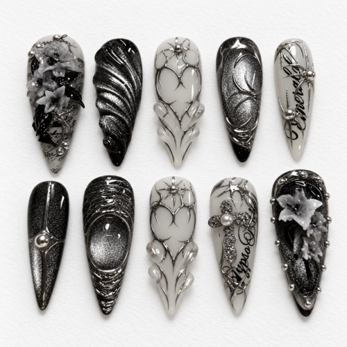 press-on nails with metallic filigree, web-like linework
