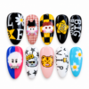 Black yellow k-pop Big Bang press-on nails with character art, bold lettering, stars and daisy accents.