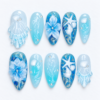 Blue ocean press-on nails with jellyfish, seashells, starfish, sculpted flowers and sparkling aqua details
