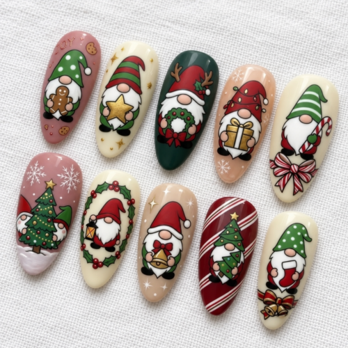 Diagonal view of Christmas press-on nails with gnomes, Christmas trees, snowflakes, bows, and bells on white linen