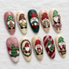 Angled view of Christmas gnome press-on nails featuring red and green hats, gold accents, and festive details on white linen.
