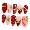 Press on nails with gold ribbon bows, snowflake bursts, leafy detail