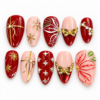 Press on nails with gold ribbon bows, snowflake bursts, leafy detail