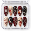 BTS Halloween press-on nails in burgundy, black and cream with moons, bats, a ghost, autumn leaves and ARMY-inspired details