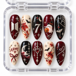BTS Halloween press-on nails in burgundy, black and cream with moons, bats, a ghost, autumn leaves and ARMY-inspired details