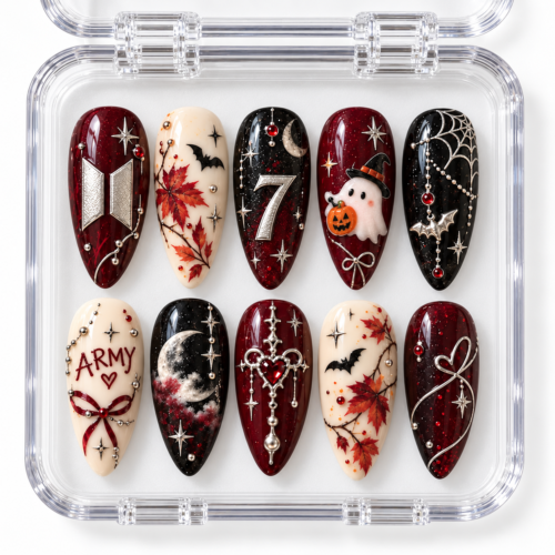 BTS Halloween press-on nails in burgundy, black and cream with moons, bats, a ghost, autumn leaves and ARMY-inspired details