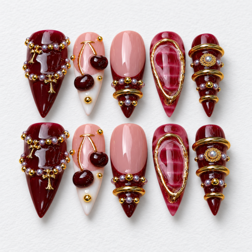 Framed gem-like centers, beadwork, chain accen press on nails