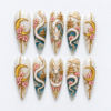 Dragon press-on nails in ivory, teal and gold with crescent moons, pink blossoms, cloud swirls and pagoda motifs