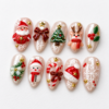 a reindeer, a Christmas tree, holly, a wreath, candy canes press on nails