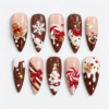 Gingerbread christmas press-on nails with chocolate-brown tips, cookie figures, candy canes, snowflakes and a tree