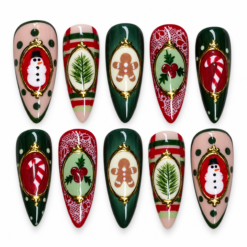 Christmas cameo press-on nails with snowmen, gingerbread, holly, candy canes and pine sprigs in red and green.