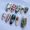 Press-on nails featuring 3D raised designs of twinkling lights.