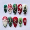 Christmas gnome press-on nails in red, green and white with a bearded gnome, 3D snowflakes, candy canes and a tree