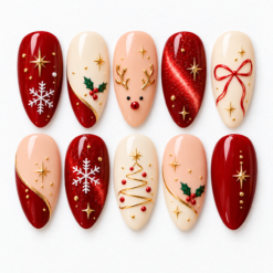 Christmas press-on nails in deep red, cream and peach with gold stars, snowflakes, holly, a reindeer face and bow