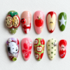 Christmas apple press-on nails with red and green apples, an apple clock, stars and a cartoon dog