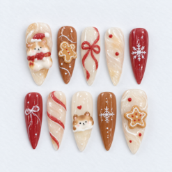 Gingerbread Christmas press-on nails in cream, cinnamon brown and red with teddy bears, cookie art, bows and snowflakes