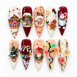 Gingerbread christmas press-on nails with a cookie house, snow globe, festive mug, wreaths, trees and holiday lights