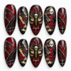 Gothic stained glass press-on nails with a skull moth, crescent moons, bats, red droplets and silver linework.
