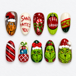 Grumpy green christmas press-on nails with holiday character art, candy canes, presents and festive lettering.