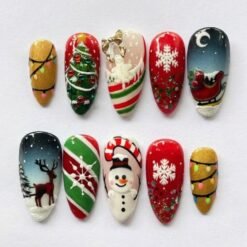 Holiday snowman press-on nails in red, green and gold with a 3D snowman, a sleigh under the moon, a reindeer and lights