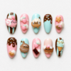Kawaii dessert cat press-on nails in pink and aqua with strawberries, cookies, chocolate, ice cream and cat designs
