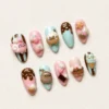 Press-on nails with cute candy and treat designs