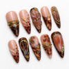 flowing gold-tone lines, leaf details, ornamental bands press on nails