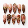 flowing gold-tone lines, leaf details, ornamental bands press on nails