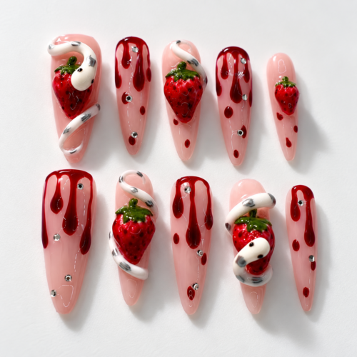 strawberry snake press-on nails with pink bases, hand-painted berries, white 3D snakes and red details