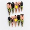 Spiders, spiderwebs, a glowing heart and black bead-like details
