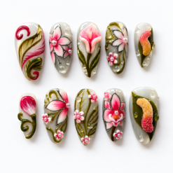 Olive floral press-on nails with pink blossoms, green leaves, pearl-like accents and red-orange textured motifs