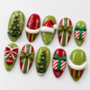press-on nails in olive green, red, cream white and gold