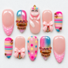 Pastel rainbow bow press-on nails with pink lace trim, colorful stripes, polka dots, jewel bands and a sculpted charm.