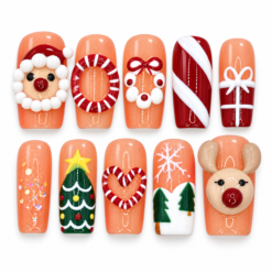 Peach christmas press-on nails with Santa and reindeer characters, candy stripes, gift bows, Christmas trees and snowflakes.