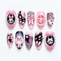 Pink gothic bunny press-on nails with framed bunny art, bows, a ghost, spiderwebs and silver accents