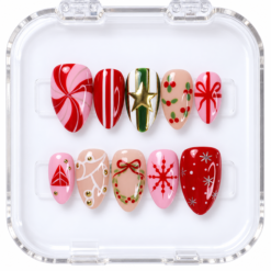Press-on nails in a clear case with pink peppermint swirls, red bows, wreath art, and a gold-tone star.