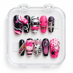Punk press-on nails in hot pink, black and white with studs, chain details, a cross charm, cow print and graphic accents