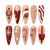 Pink reindeer christmas press-on nails with candy canes, bows, snowflakes and peppermint details