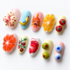 Press-on nails with orange and lemon patterns