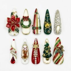 Christmas wreath press-on nails in red, green and ivory with a 3D poinsettia, a glitter wreath, a tree and rhinestones